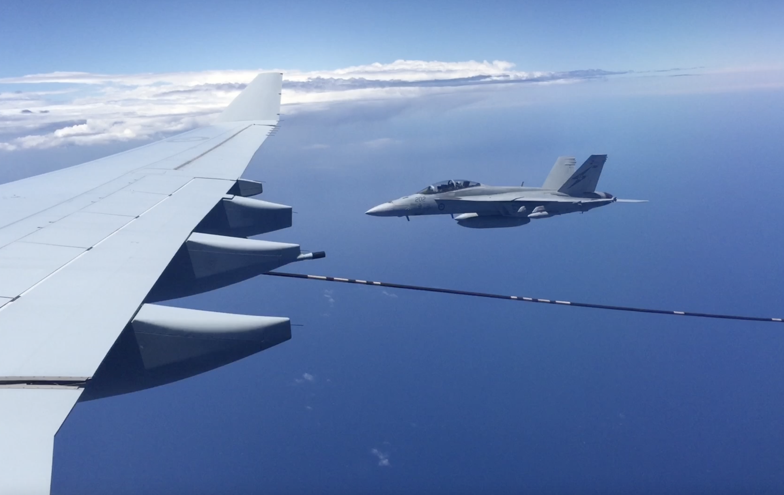 F/A-18 Super Hornet flying alongside an A330 MRTT